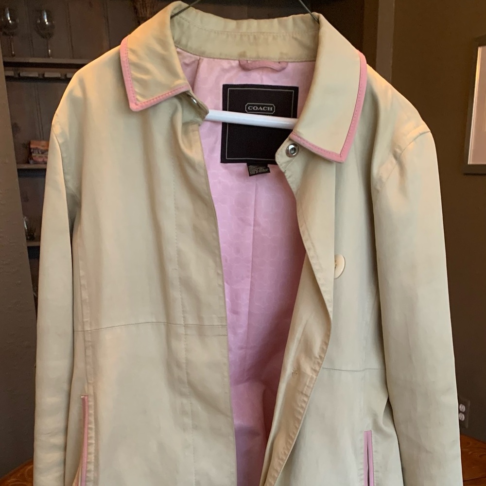 Coach trench coat with pink leather accents and liner.
